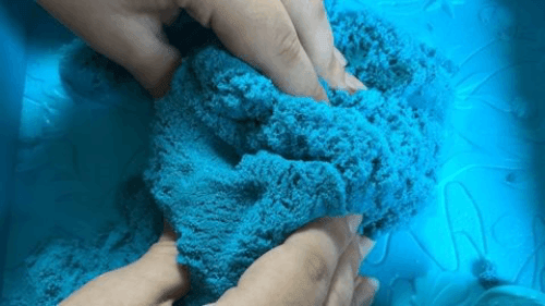 Visit Redcliffe QLD Event image playing with blue kinetic sand