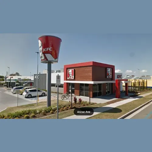 KFC Redcliffe image of the outside of KFC fast food restaurant, including the sign and parking lot