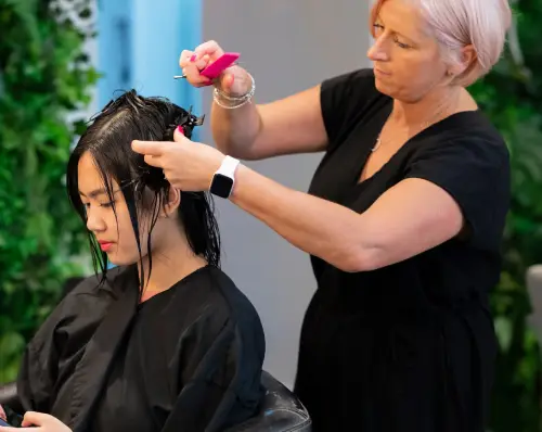 Visit redcliffe qld image of Haley's men’s and women's hair studio hairdresser  cutting a client's hair