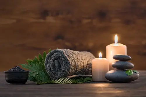 Visit redcliffe qld image of relaxing candles, stones, a towel
